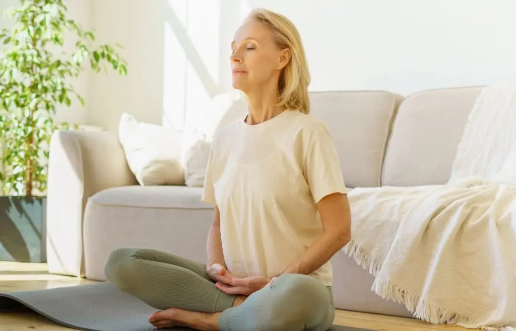 Woman doing box breathing showing how it should be performed
