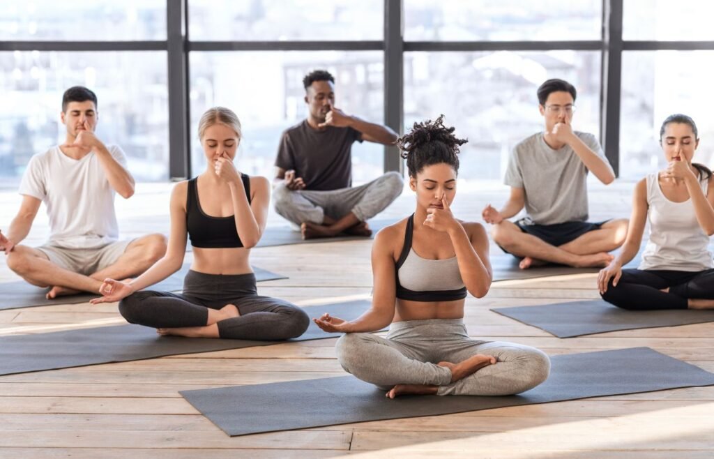 Group of people doing alternate nostril breathing