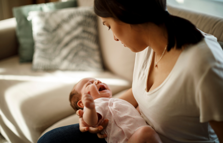 mother holding fussy baby